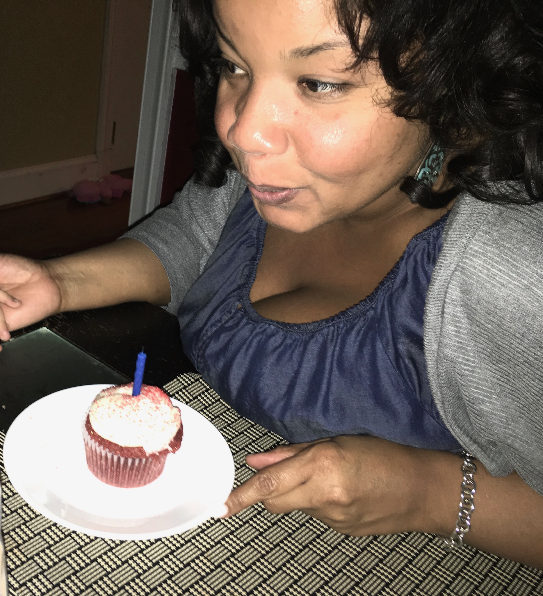 Photo of my sister with a birthday cupcake